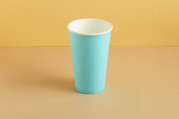 Coffee cup on ground color background