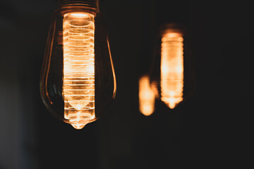 Hanging Vintage bulbs with warm orange light.