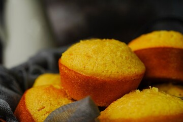 Homemade Corn / cornbread muffins on dark moody background, selective focus