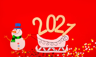 New year's composition in 2020. Stylish decor concept, Christmas snowman with paper sleigh on red background. Flat bed, top view, postcard Background
