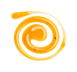 Dripping orange sauce isolated on white background. Abstract pattern made of chilli sauce. Flat lay, top view, close up.