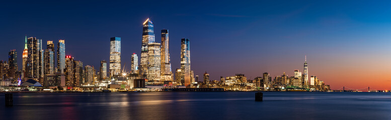 Manhattan West skyline at sunset. Skyscrapers of Hudson Yards and World Trade Center. Cityscape from across Hudson River, New York City, NY, USA