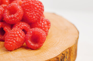 group of fresh red raspberry  on wood