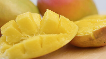 group of delicious mango tropical fruit on wood board