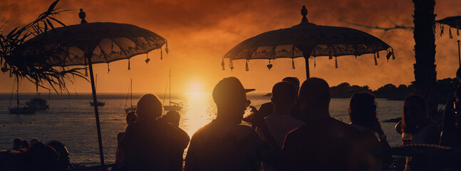 People at sunset on Calo des Moro in Ibiza. Spain