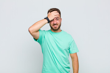 young man panicking over a forgotten deadline, feeling stressed, having to cover up a mess or...