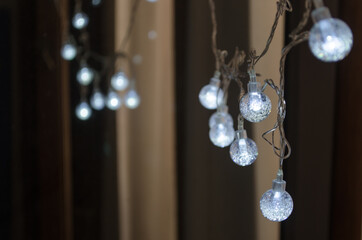 Selective focus of Christmas lights bulbs.