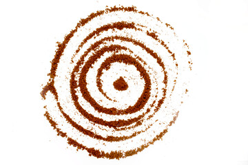 Texture of ground brown coffee in the form of a spiral on white background.