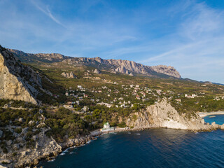 Aerial view to sea shore with buidings and mountains near Simeiz village, Crimea