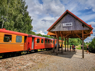 Fototapeta na wymiar Narrow gauge railway train and station in Rubikiai, Anyksciai district