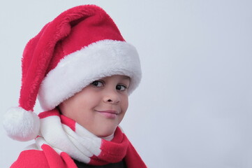 little boy with Christmas hat on his head with white background stock photo