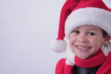 little boy with Christmas hat on his head with white background stock photo