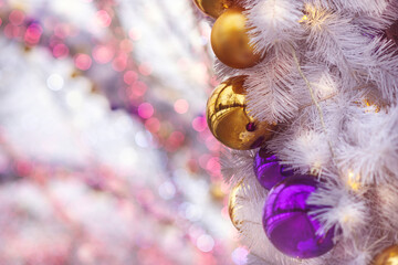 Christmas background of balloons and garlands, pink color, bokeh. Concept of a greeting card for New year, Christmas, and thanksgiving. Horizontal format, shallow depth of field