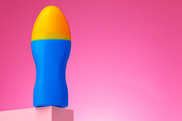 Skincare beauty products container against pink background