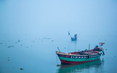 Fisherman fishing in the winter morning,