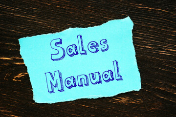 Business concept about Sales Manual with sign on the sheet.