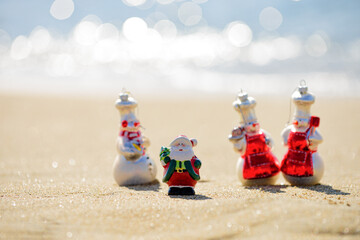 Fototapeta premium Summer Santa Claus. New Year concept for travel destinations in hot tourist countries.