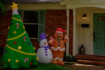 Christmas toy. New year decorations for house. Gingerbread and snowman on yard.