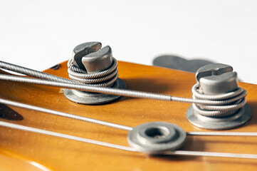 Detail of a tuning post of an electric bass