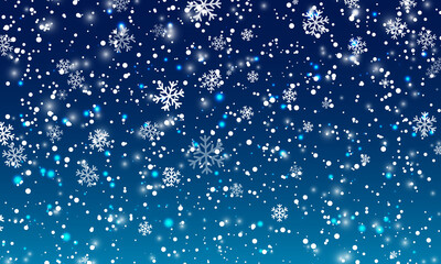 Snow background. Winter snowfall. White snowflakes on blue sky. Christmas background. Falling snow.