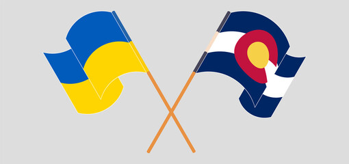 Crossed and waving flags of the Ukraine and The State of Colorado