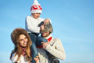 happy playing family in the winter. people outdoors - 394775364