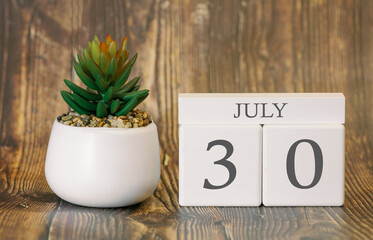 Flower pot and calendar for the warm season from 30 July. Summer time.