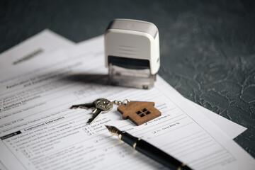 House keys and unemployment form. Crisis concept.