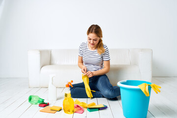 cleaning lady on the floor bucket rubber gloves housework 