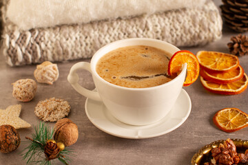 
Cup of hot chocolate on a table with winter decorations
