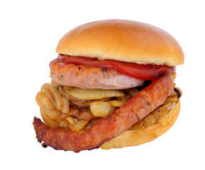 Cumberland sausage and fried onion sandwich in a brioche bread roll isolated on a white background