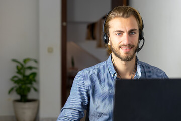 Male working from home with headphones