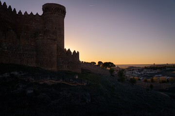 Obraz premium Exterior view of the medieval castle and the village of Belmonte at sunset, Cuenca, Spain