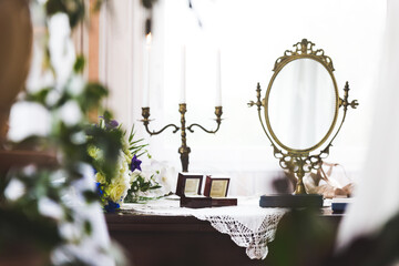 wedding rings in boxes on a table