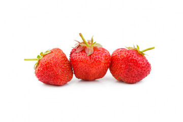 Three strawberries with strawberry leaf on white background.