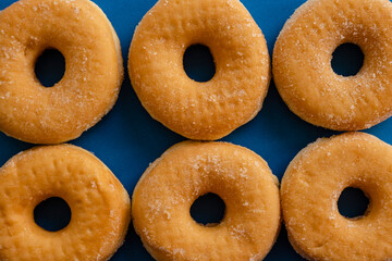 six doughnuts on blue background