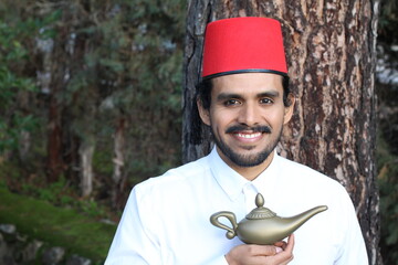 Arabic man holding magic lamp
