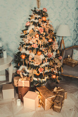 Luxury interior of living room with decorated Christmas tree and gifts on the wooden floor