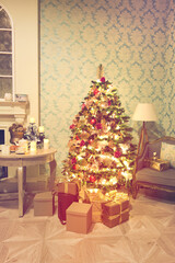 Luxury interior of living room with decorated Christmas tree and gifts on the wooden floor