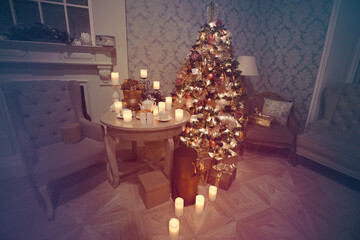 Luxury interior of living room with decorated Christmas tree and gifts on the wooden floor