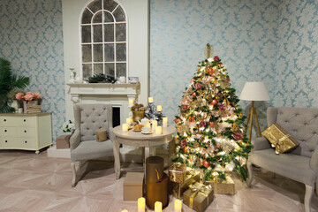 Luxury interior of living room with decorated Christmas tree and gifts on the wooden floor