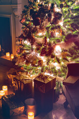 Luxury interior of living room with decorated Christmas tree and gifts on the wooden floor