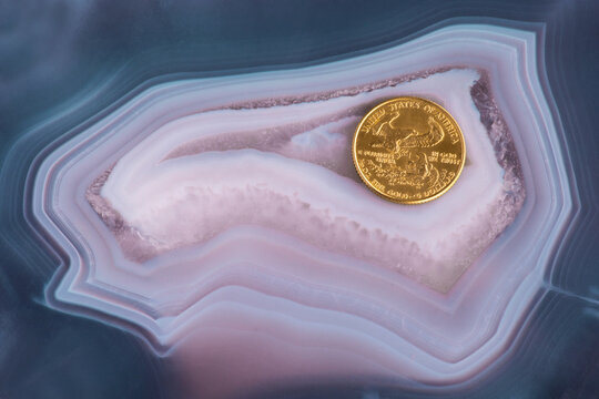 Eagle Side Of Gold US Ten-cent Coin On A Beautiful Agate Thunderegg.