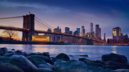 Waterside view of Brooklyn Bridge in New York