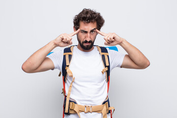 young man with a serious and concentrated look, brainstorming and thinking about a challenging problem