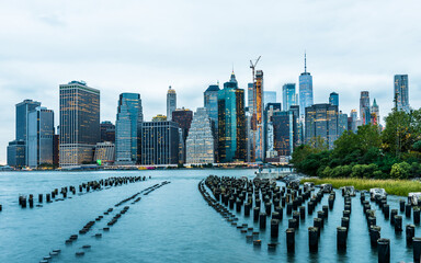 Manhattan panoramic skyline at sunset from Brooklyn Bridge Park. New York City, USA.