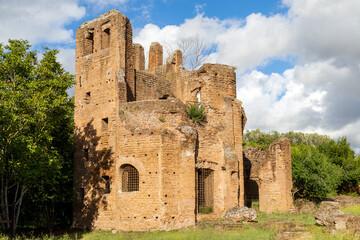 Fototapeta na wymiar Particular of Ancient ruins of circus of Maxentius along Via Appia or Appian Way Rome Italy, with a beautiful sun, clouds and nature.