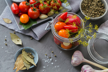 Homemade canning. Ingredient for pickles tomatoes with dill on a kitchen table. Vegetable salads for winter.