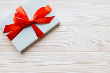 Top view gift boxes on a white wooden background with copy space