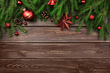 Fototapeta na wymiar Winter holidays background with fir tree branches and christmas decorations